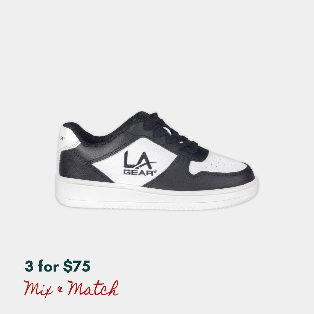 Black and white lowtop sneaker with 'LA Gear' logo on a light gray background