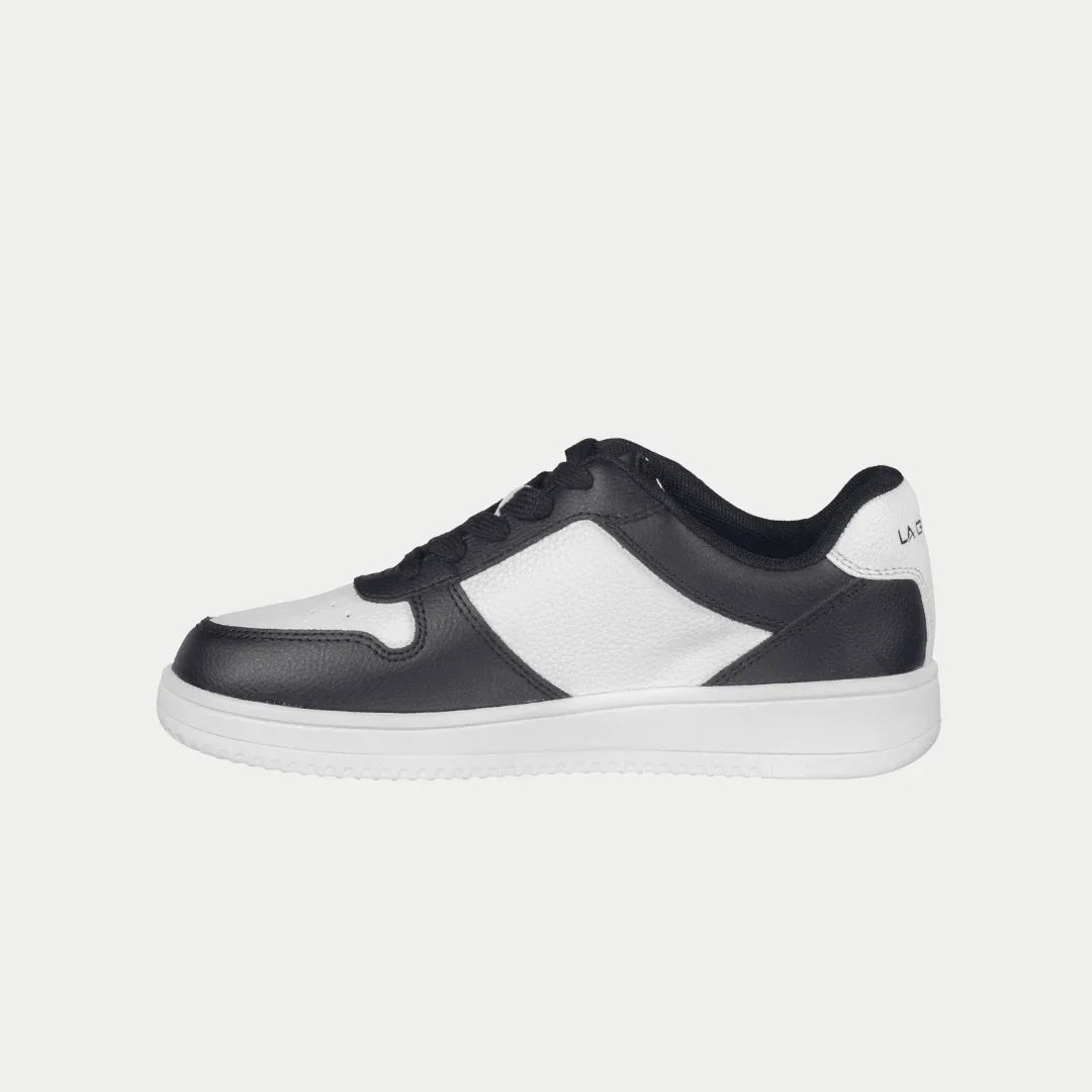 Black and white lowtop sneaker on a light gray background