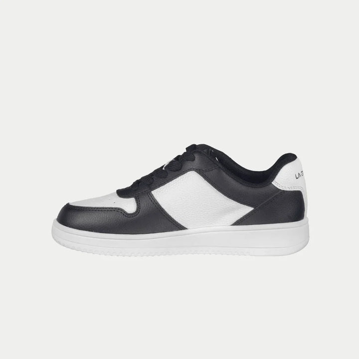 Black and white lowtop sneaker on a light gray background