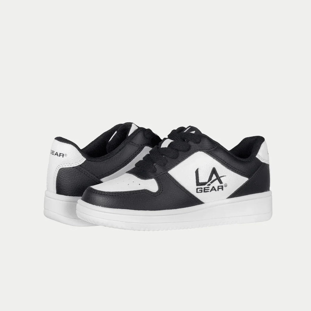 Black and white lowtop sneakers with LA Gear logo on a light gray background