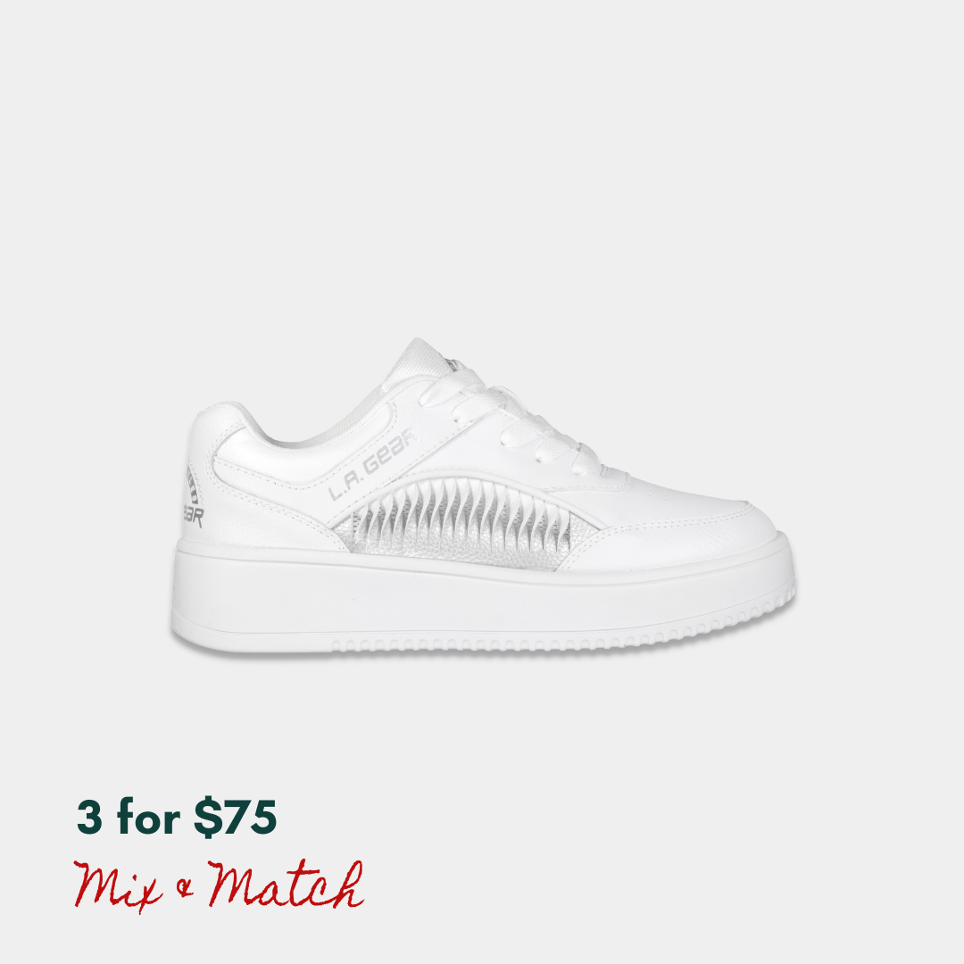 White lowtop sneaker with LA Gear logo on a light gray background