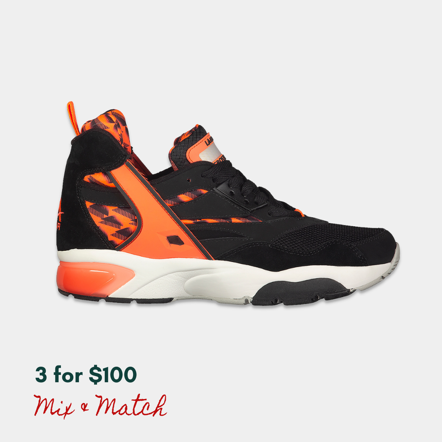 Black x neon red mid LA Gear sneaker on a light gray background with a light-up, rechargeable tongue