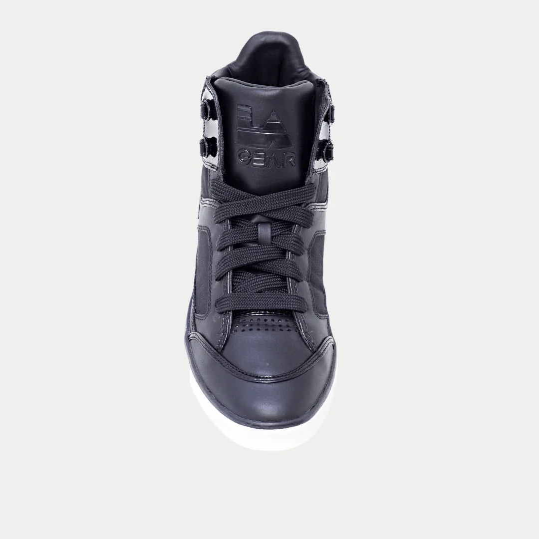 Black hightop sneaker on a light gray background