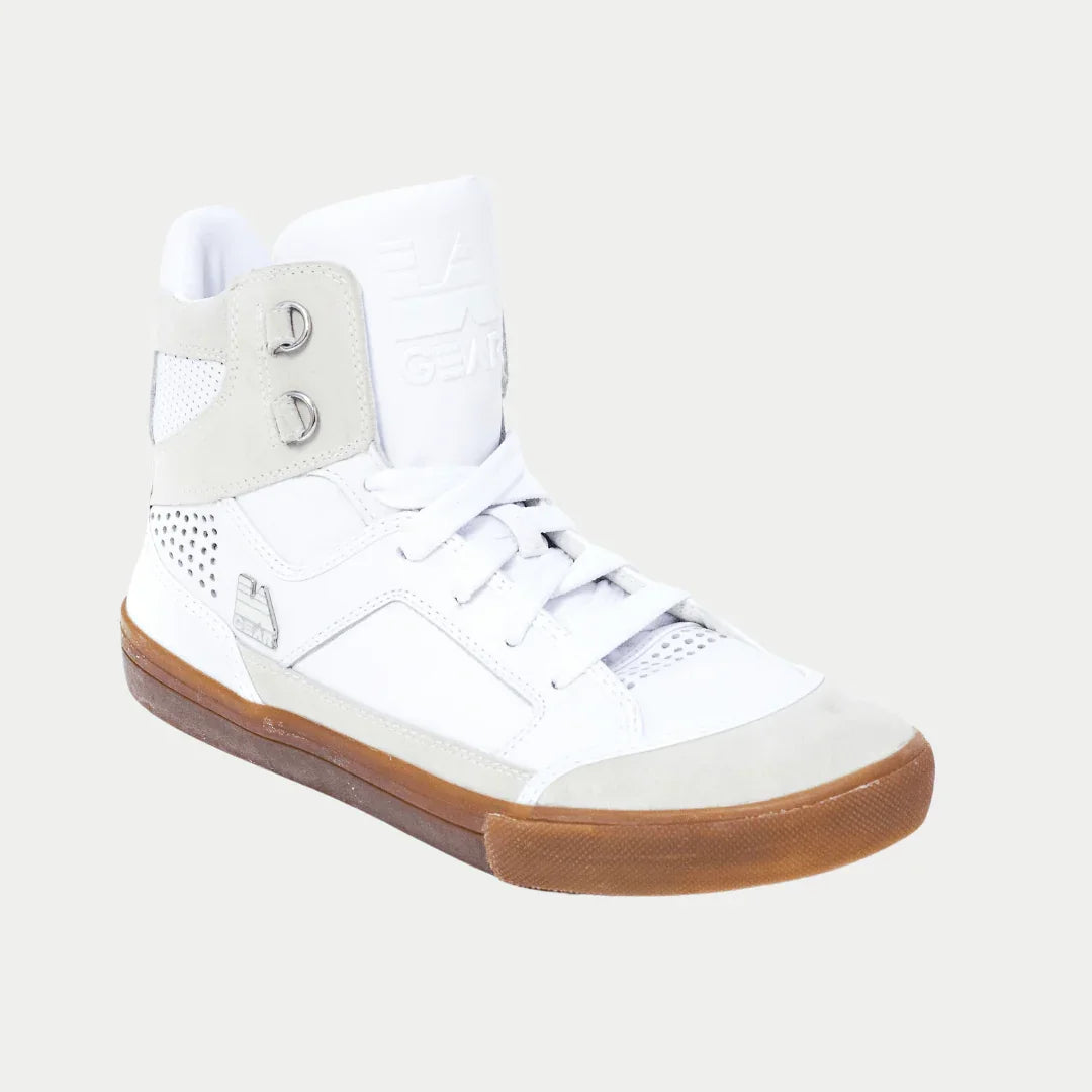 White hightop sneaker with brown sole on a light gray background