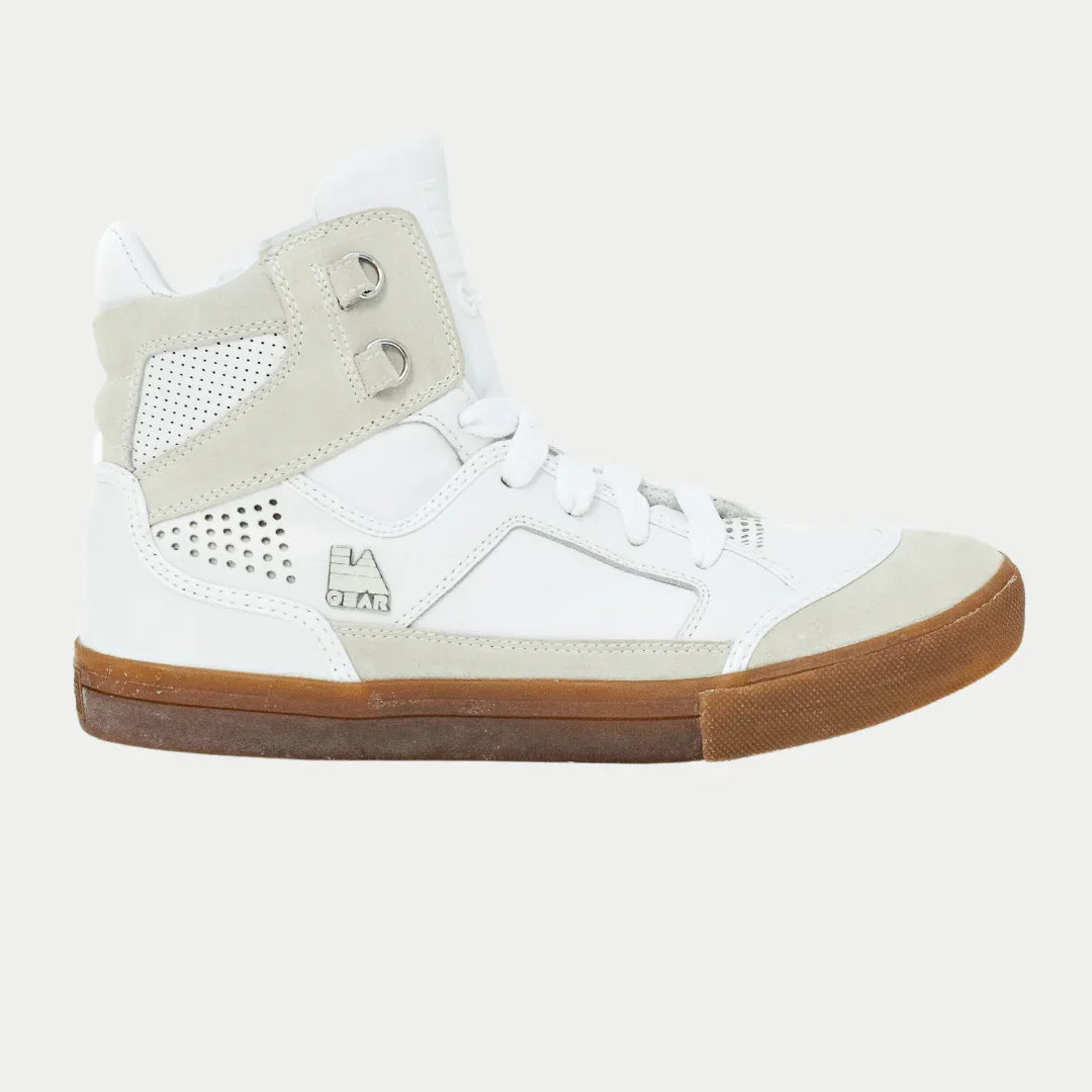 White hightop sneaker with brown sole on a light gray background