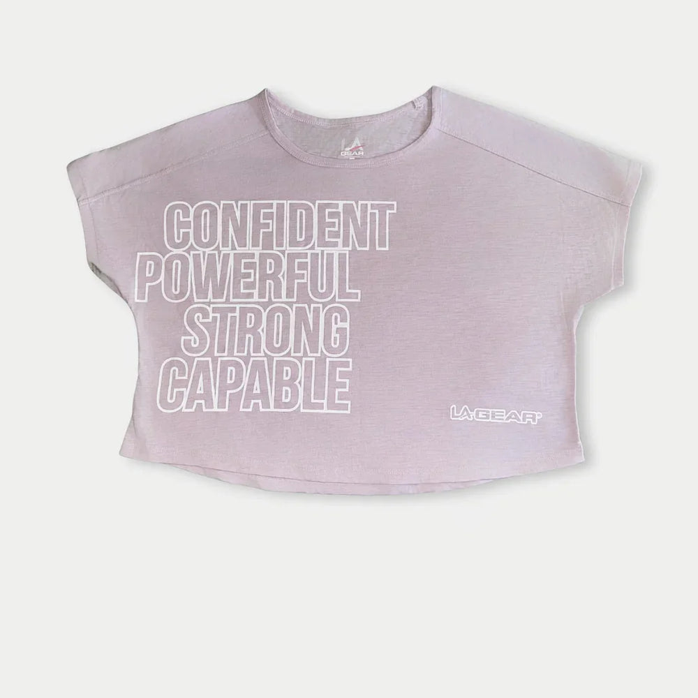 Lavender-pink capped sleeve top with motivational text on a white background