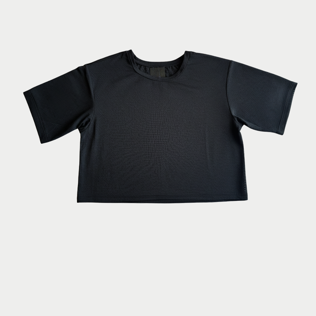 Black short-sleeve top on a light gray background