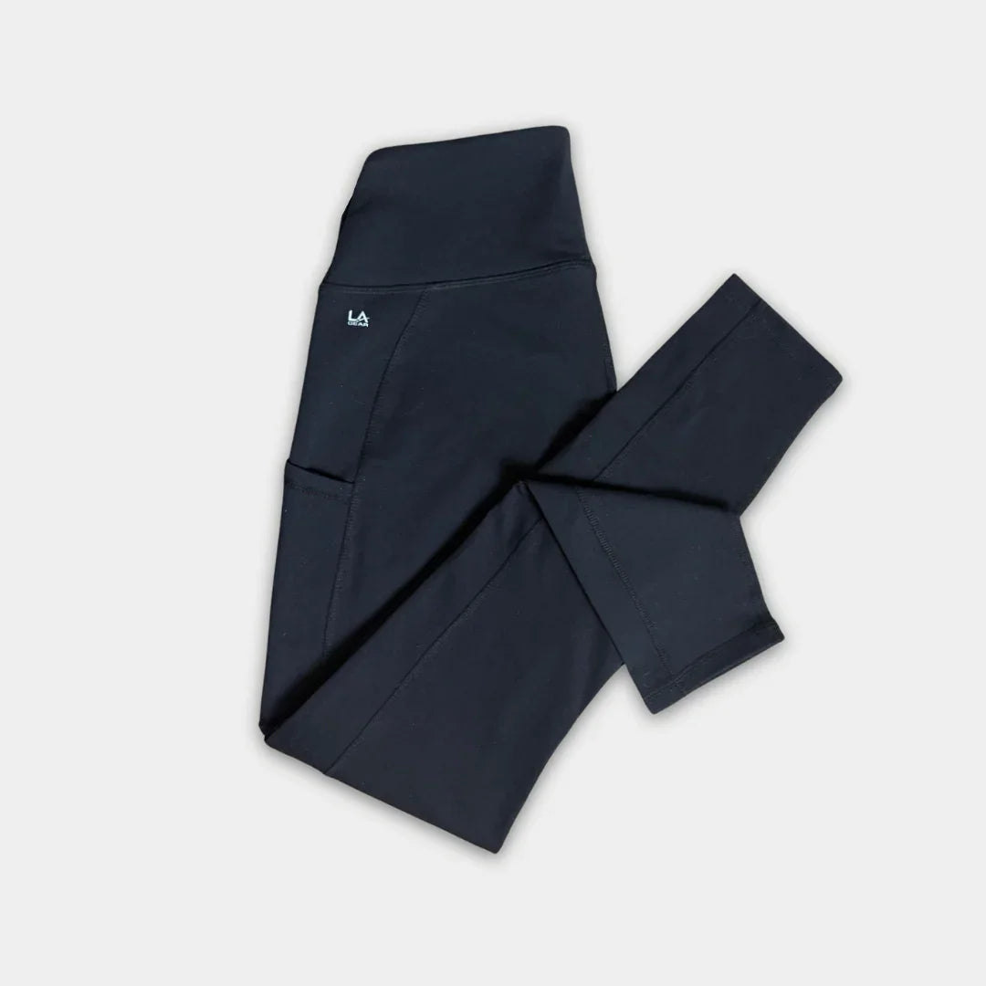 Black pants with a logo on a light gray background
