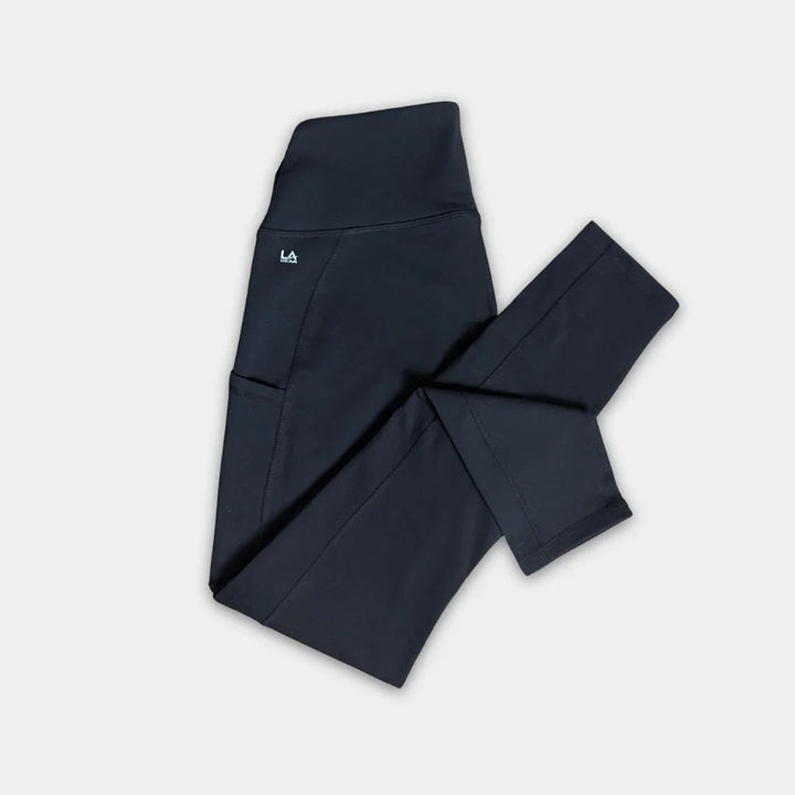 Black pants with a logo on a light gray background