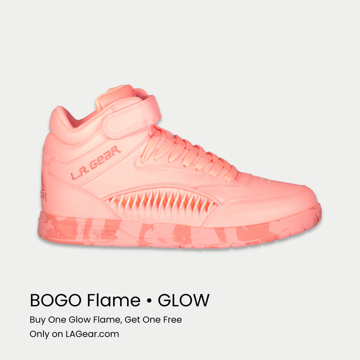 Neon peach sneaker with 'L.A. Gear' branding on a light gray background