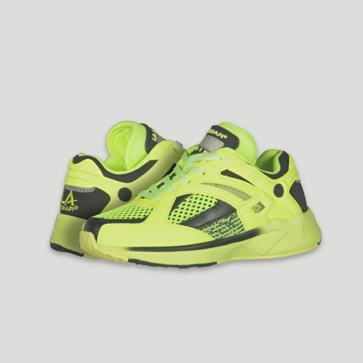 LA Gear neon yellow x black  lowtop sneaker, motion-activated light-up tongue and glow-in-the-dark accents that shine long after the lights go out. 