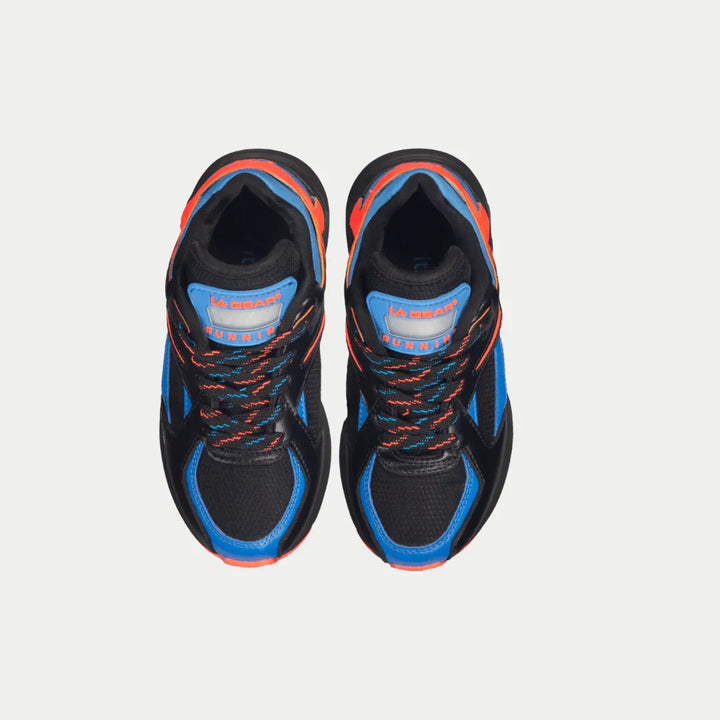 Black and blue lowtop shoes with orange accents on a light gray background