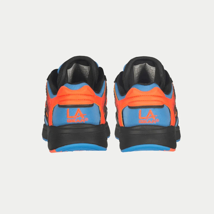 Back view of black and orange sneakers with blue accents on a white background