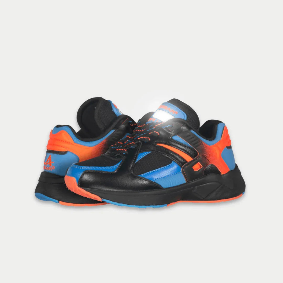 Black, blue, and orange lowtop shoe on a light gray background