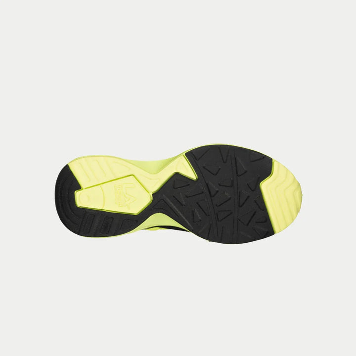 Sole of a black and yellow athletic shoe on a light gray background