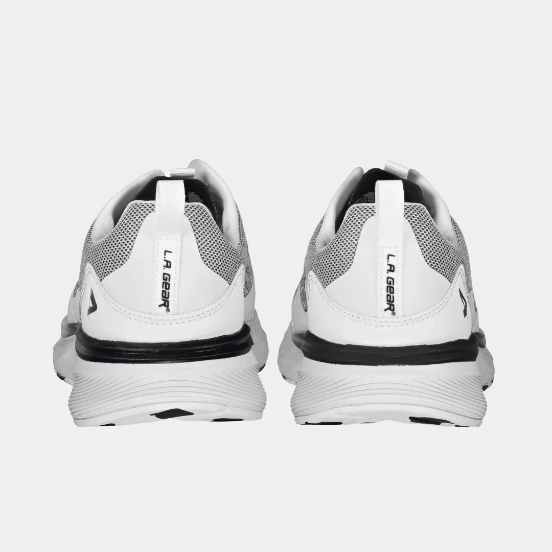White x black shoes with LA Gear branding on the heel on a light gray background