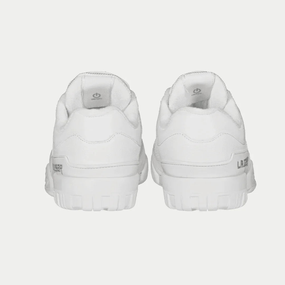 Pair of white sneakers on a light gray background