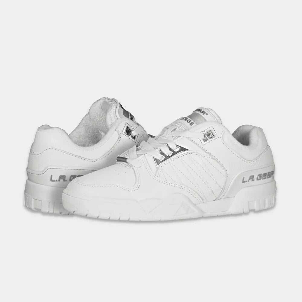 White sneakers with brand logo on a light gray background