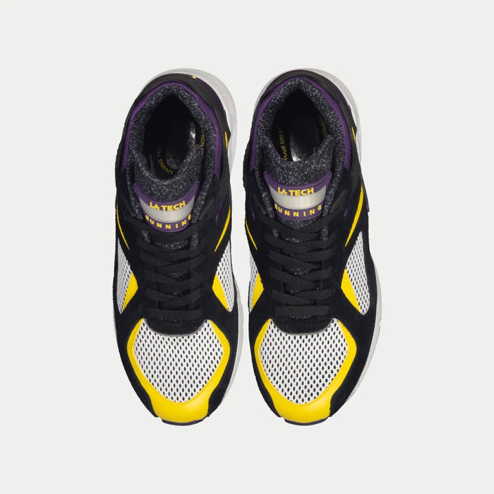 Black, yellow, and purple sneakers on a light gray background