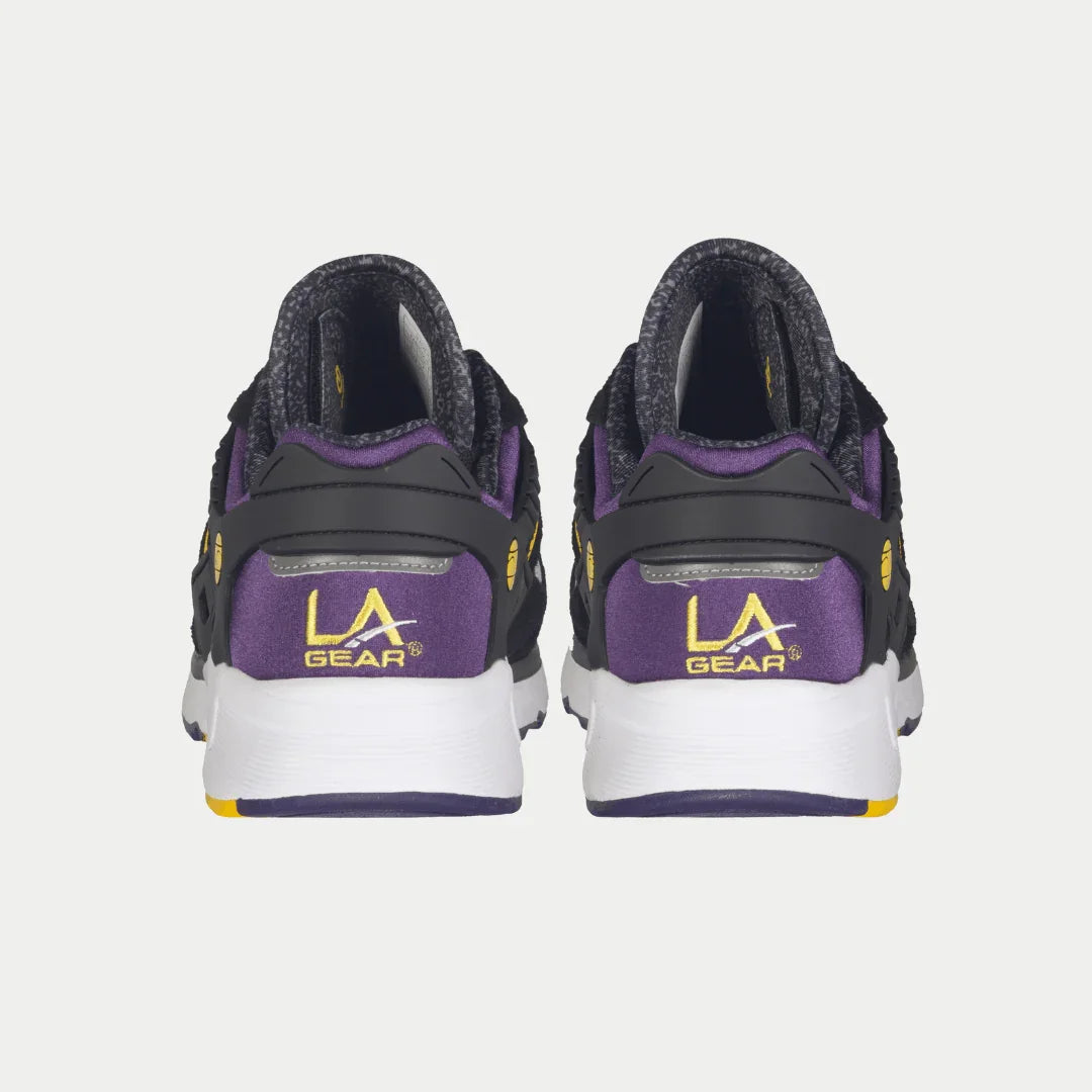 Back view of black and purple LA Gear sneakers on a white background