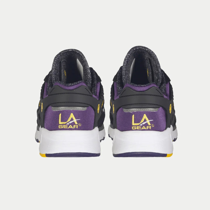 Back view of black and purple LA Gear sneakers on a white background