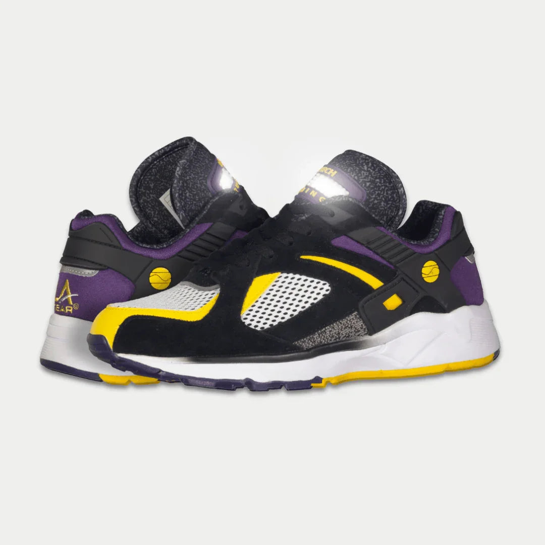 Black, purple, and yellow sneaker on a light gray background