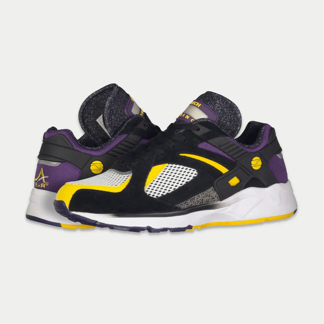Black, purple, and yellow sneakers on a white background