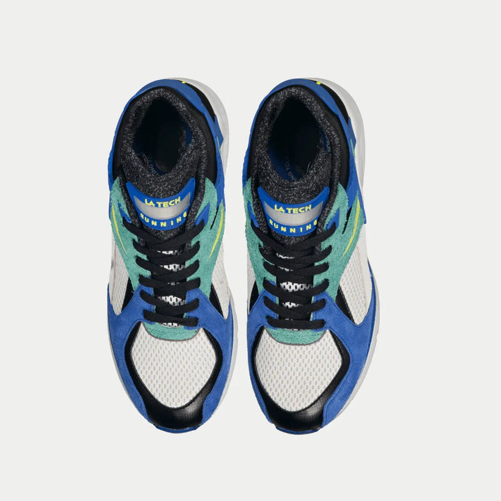 Pair of blue x green sneakers on a light gray background