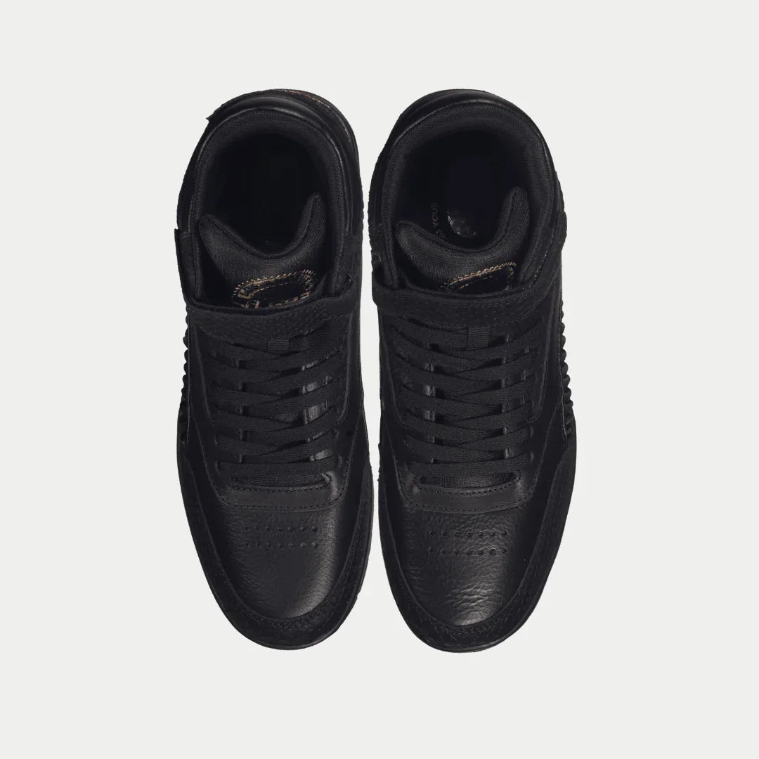 Pair of black hightop sneakers on a light gray background