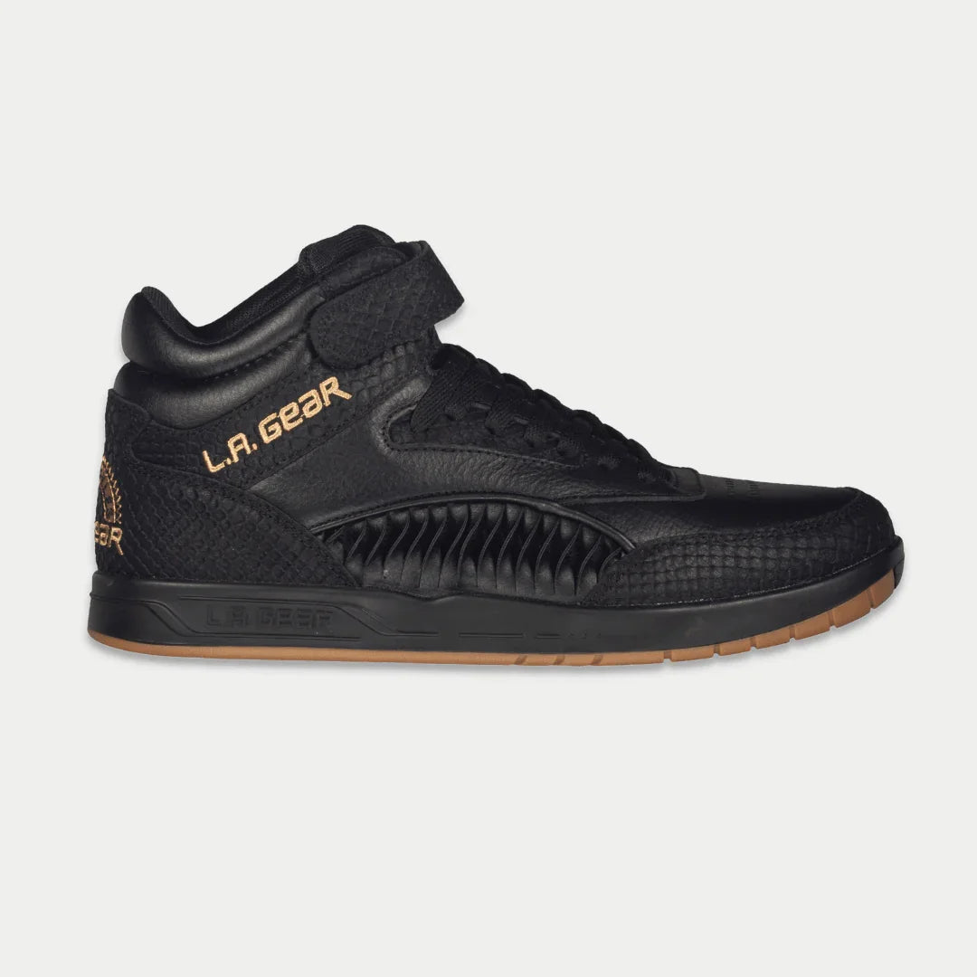 Black hightop sneaker with 'LA Gear' branding on a light gray background