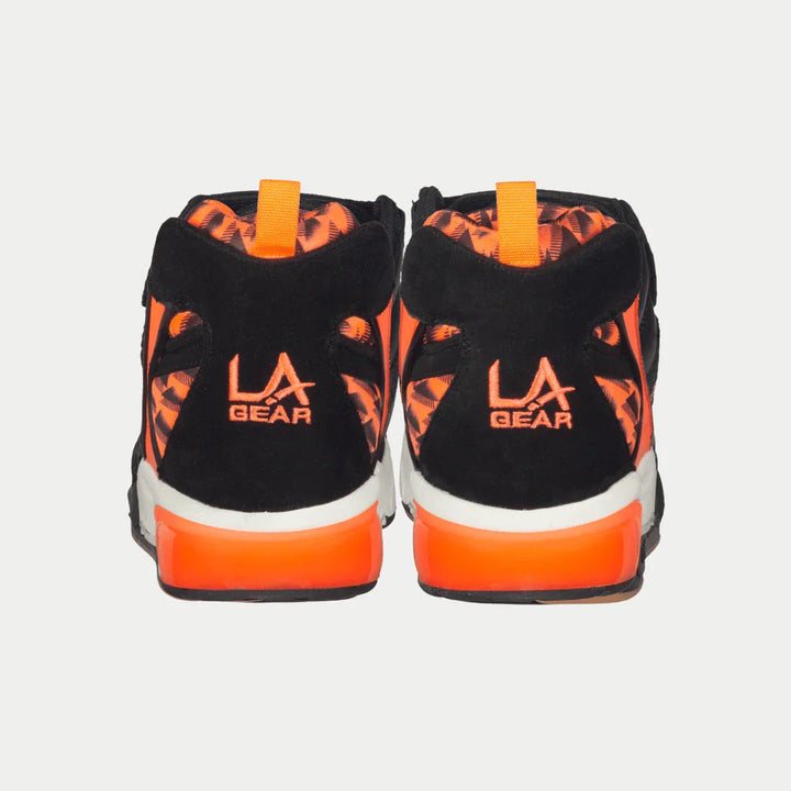 Black x neon red sneakers with 'LA Gear' branding on a light gray background