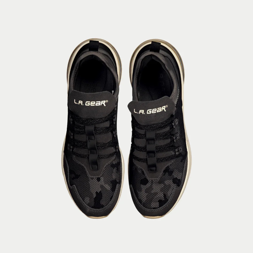 Black sneakers with 'L.A. Gear' branding on a white background