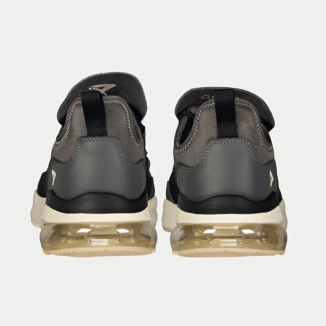 Pair of gray and black sneakers on a white background