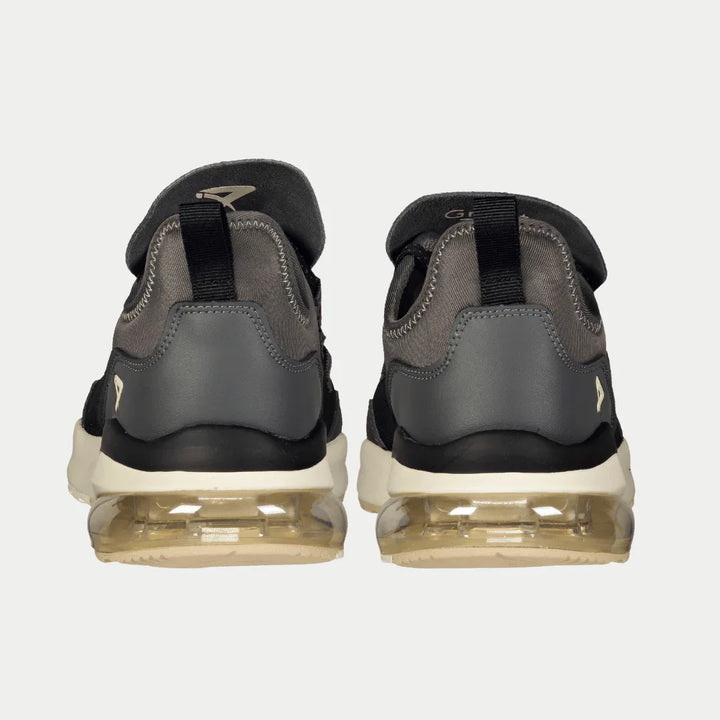 Pair of gray and black sneakers on a white background