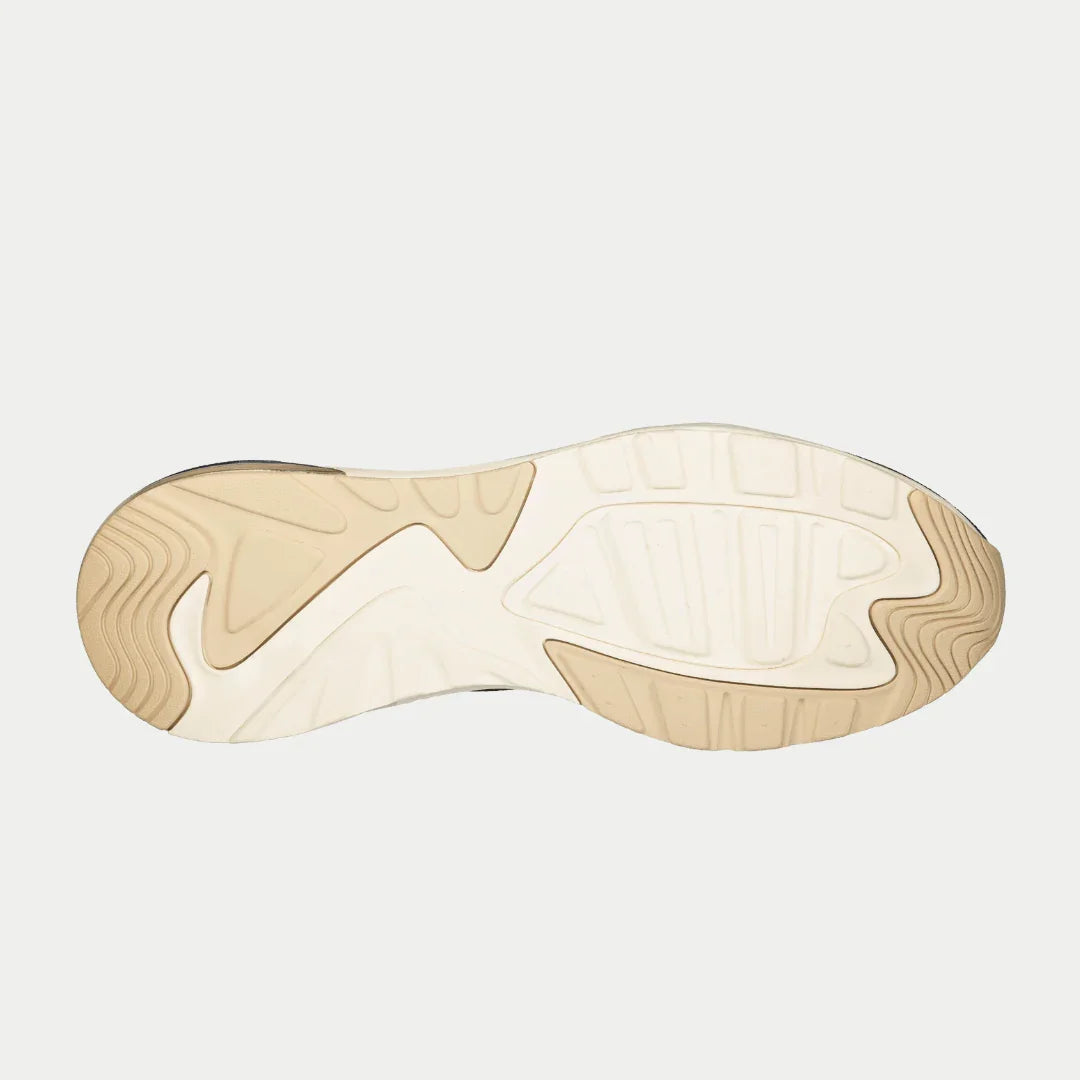 Close-up of a shoe sole with a neutral color palette on a light gray background