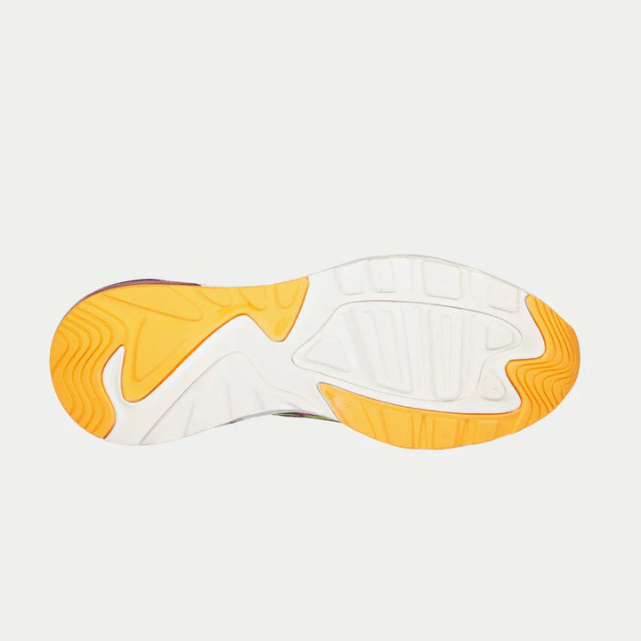 Close-up of a shoe sole with orange and white design on a light gray background