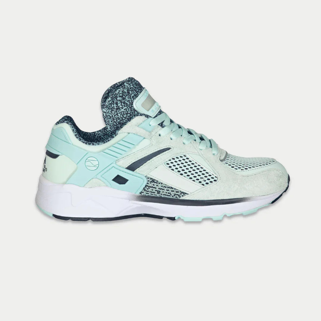 Mint x Black shoe with white sole on a light gray background