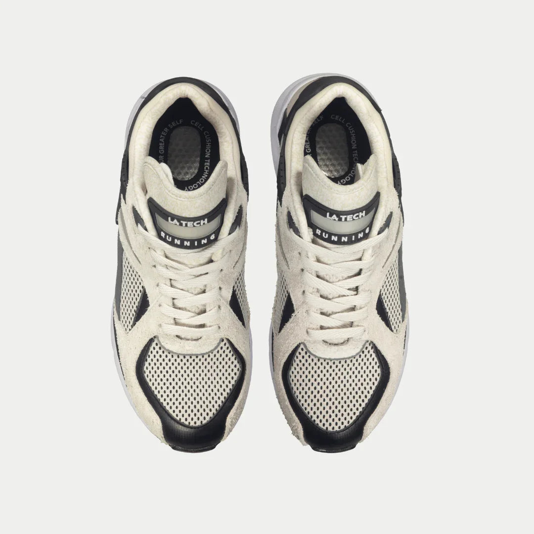 White and black running shoes with 'La Tech' branding on a light gray background