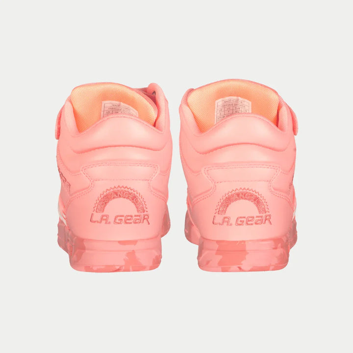 Pair of neon peach LA Gear shoes on a light gray background