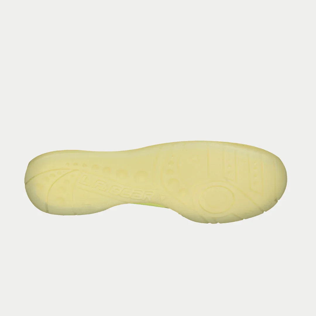Yellow shoe sole on a light gray background