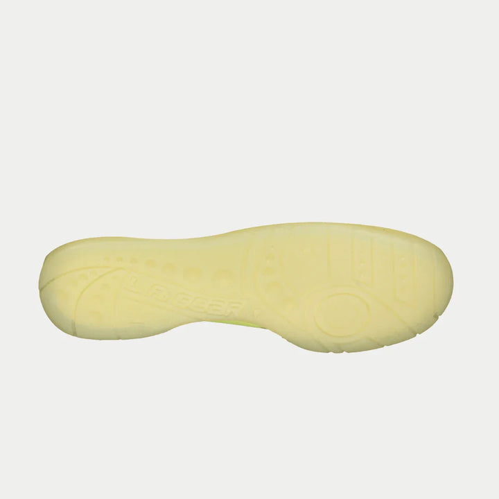 Yellow shoe sole on a light gray background
