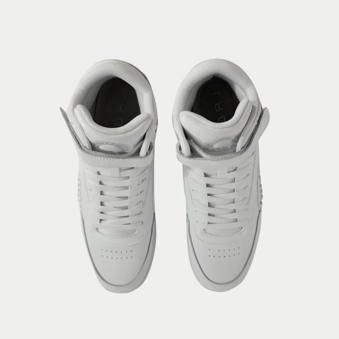 Pair of white hightop sneakers on a light gray background