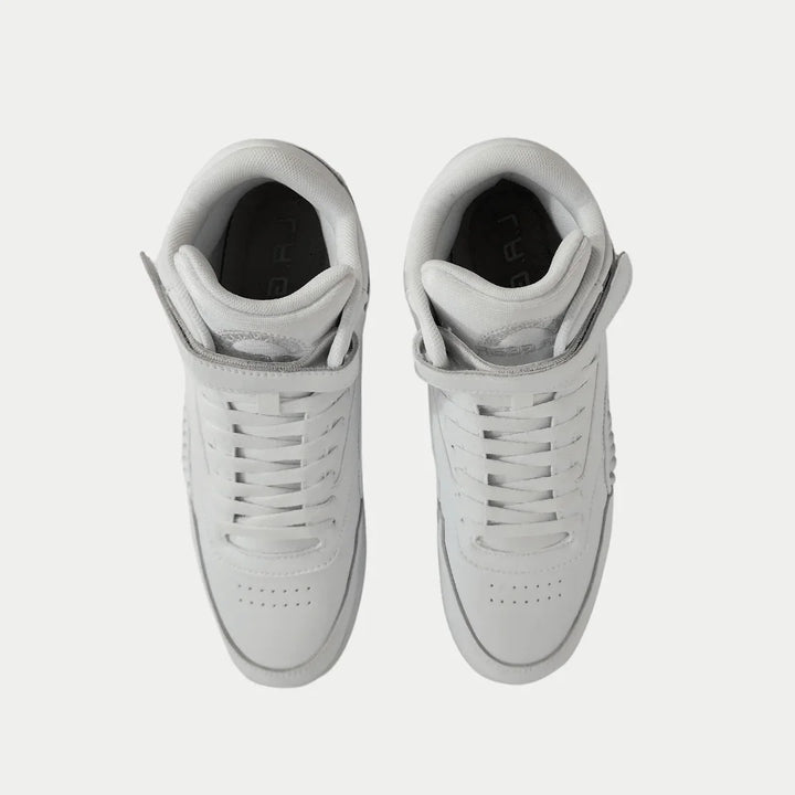 Pair of white hightop sneakers on a light gray background