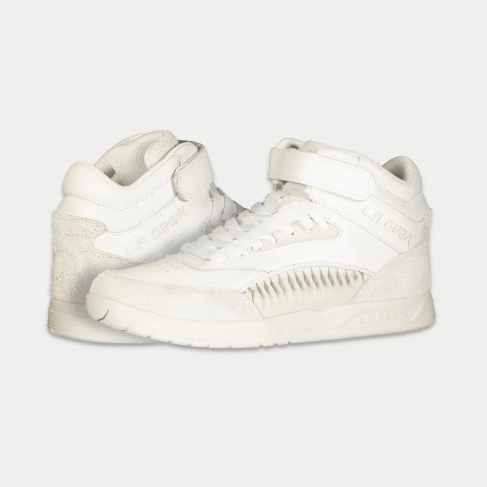 White hightop sneakers on a light gray background