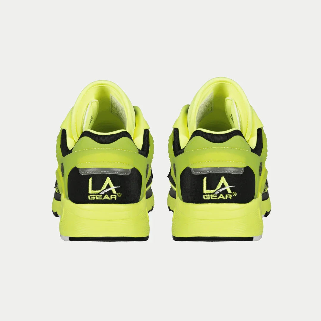 Pair of neon green sneakers with 'LA Gear' logo on a light gray background