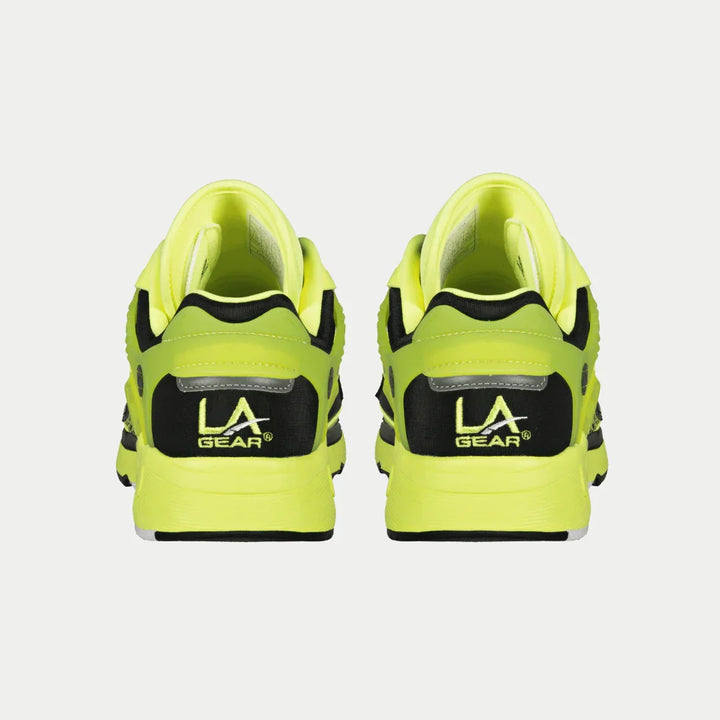 Pair of neon green sneakers with 'LA Gear' logo on a light gray background