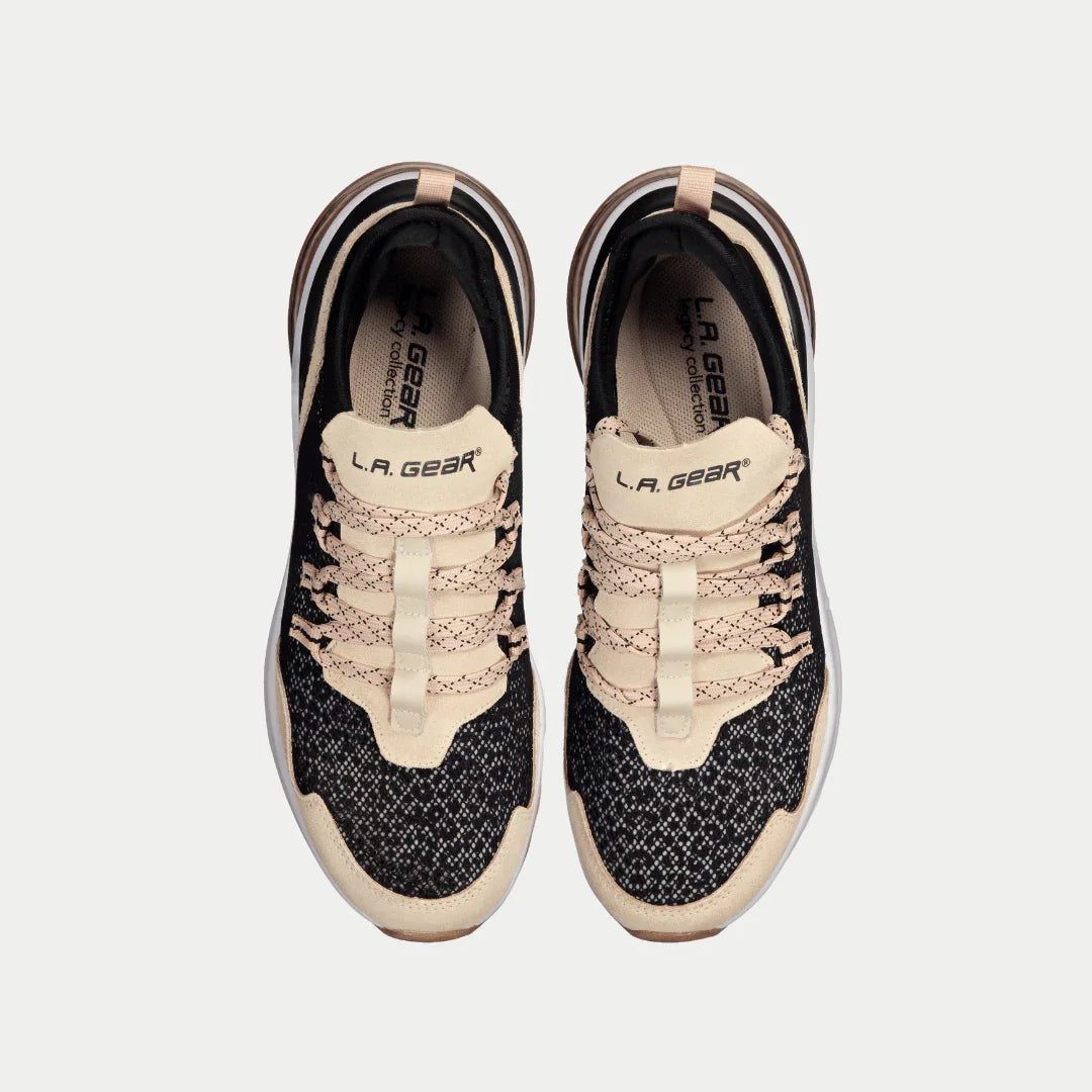 Pair of black and pink sneakers with 'L.A. Gear' branding on a light gray background