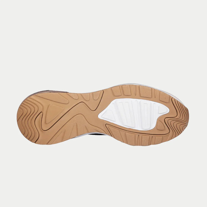 Sole of a shoe with a white sole and brown sole pattern on a light gray background