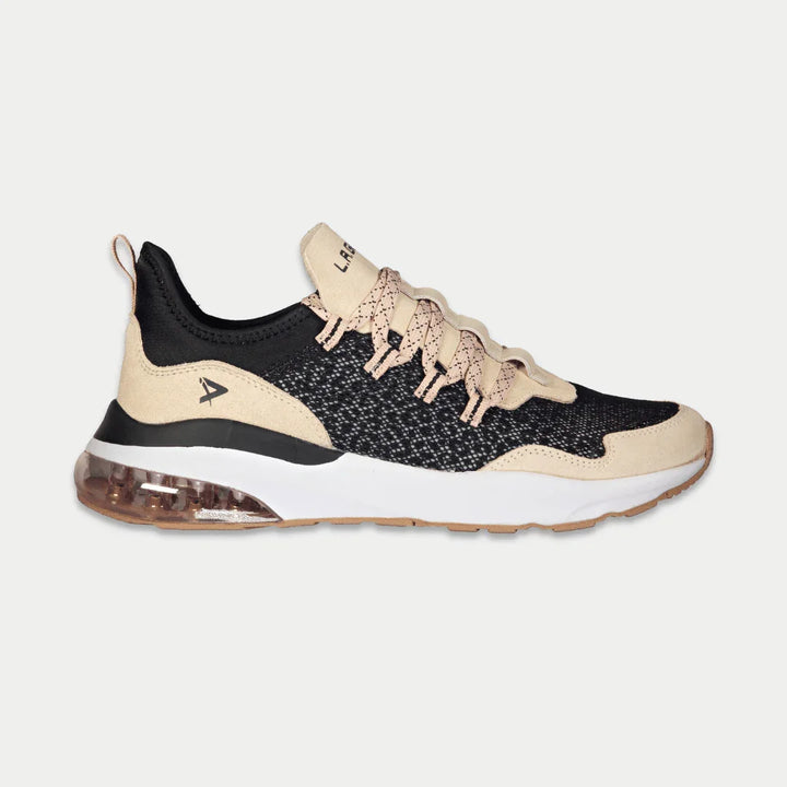 Black and pink sneaker with a white sole on a light gray background