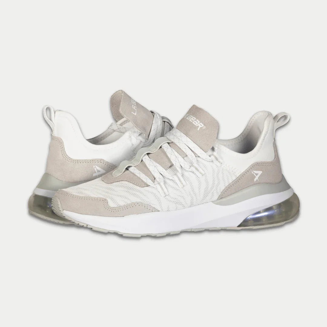 Pair of white x gray sneakers on a light gray background